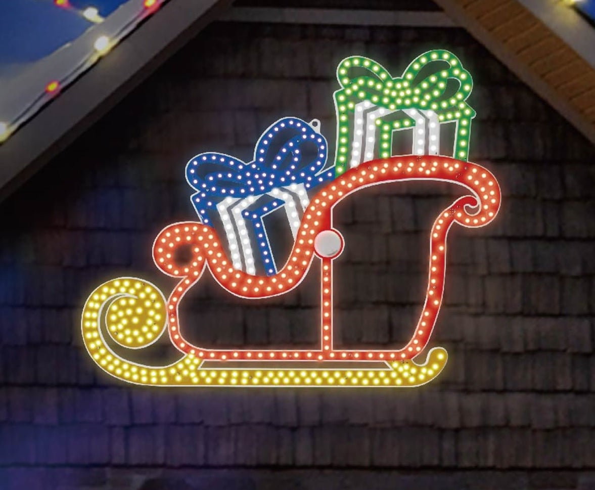 Outdoor LED Christmas decoration shaped like a sleigh with presents inside. It's lit with blue, pure white, green and yellow lights.