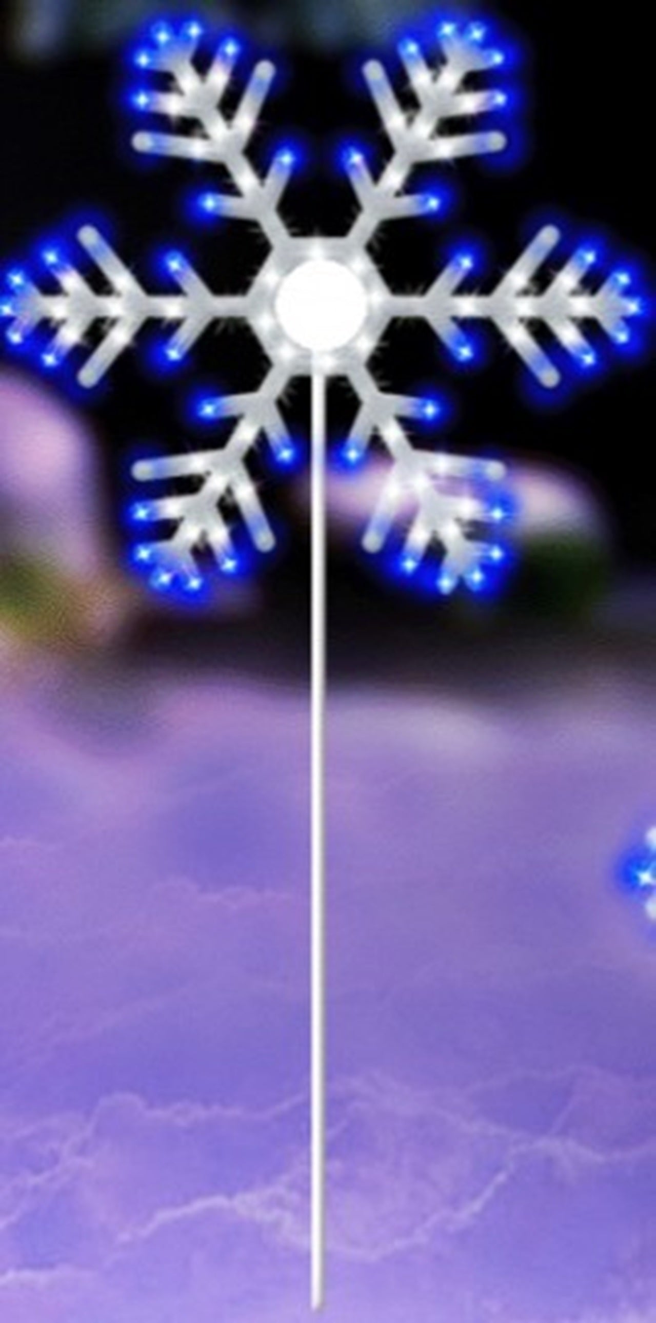 Lighted decoration shaped like a snowflake with twinkling pure white and blue lights.