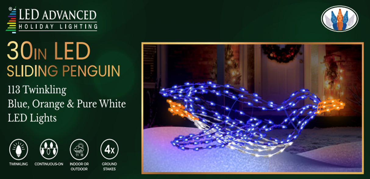 Outdoor LED wire sculpture shaped like a blue penguin sliding. Pre-lit with blue, pure white and orange lights.