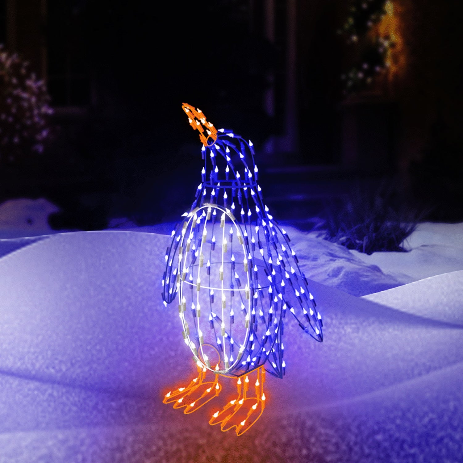 Outdoor LED wire sculpture shaped like a standing penguin. Pre-lit with blue, pure white and orange lights.
