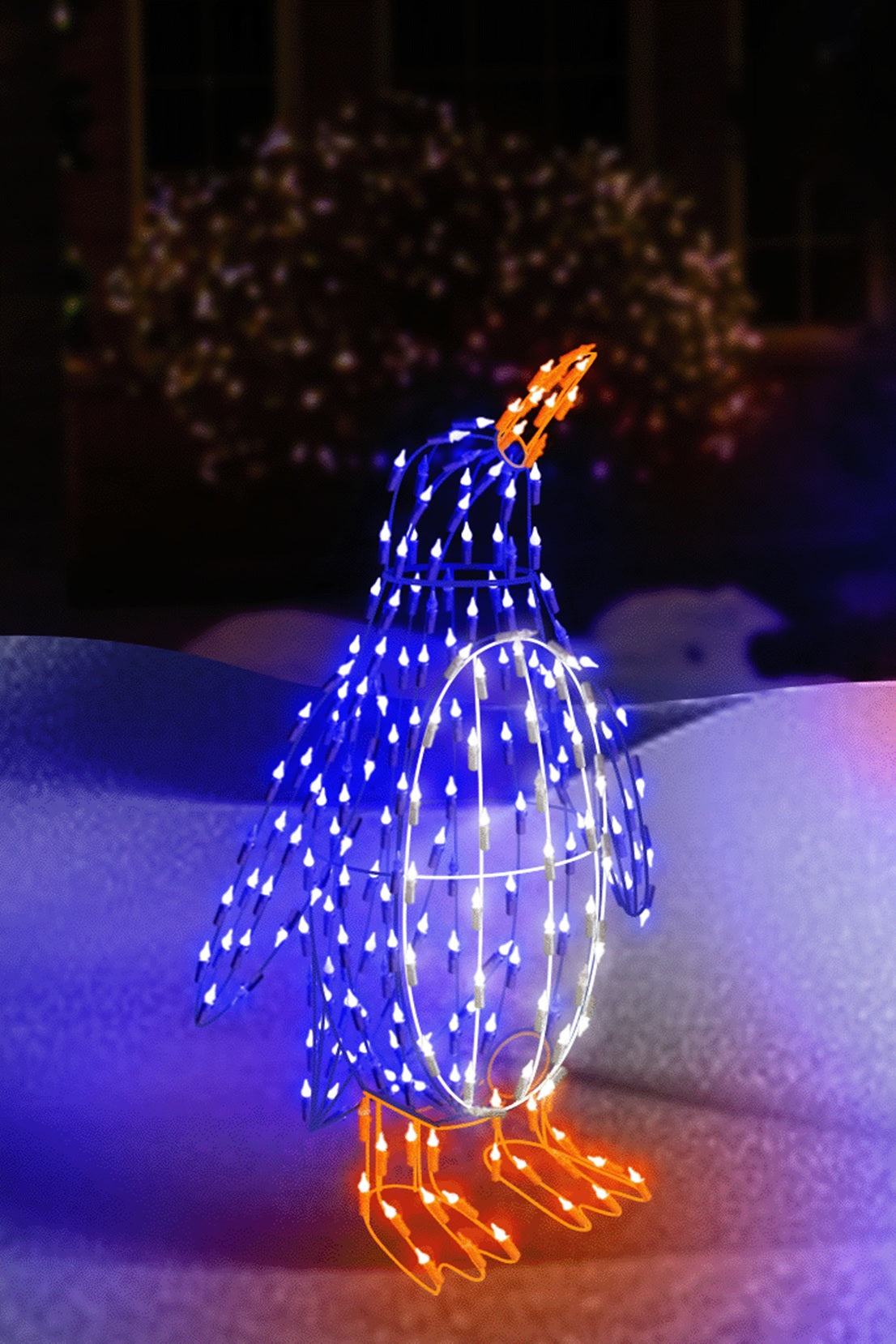 Outdoor LED wire sculpture shaped like a standing penguin. Pre-lit with blue, pure white and orange lights.