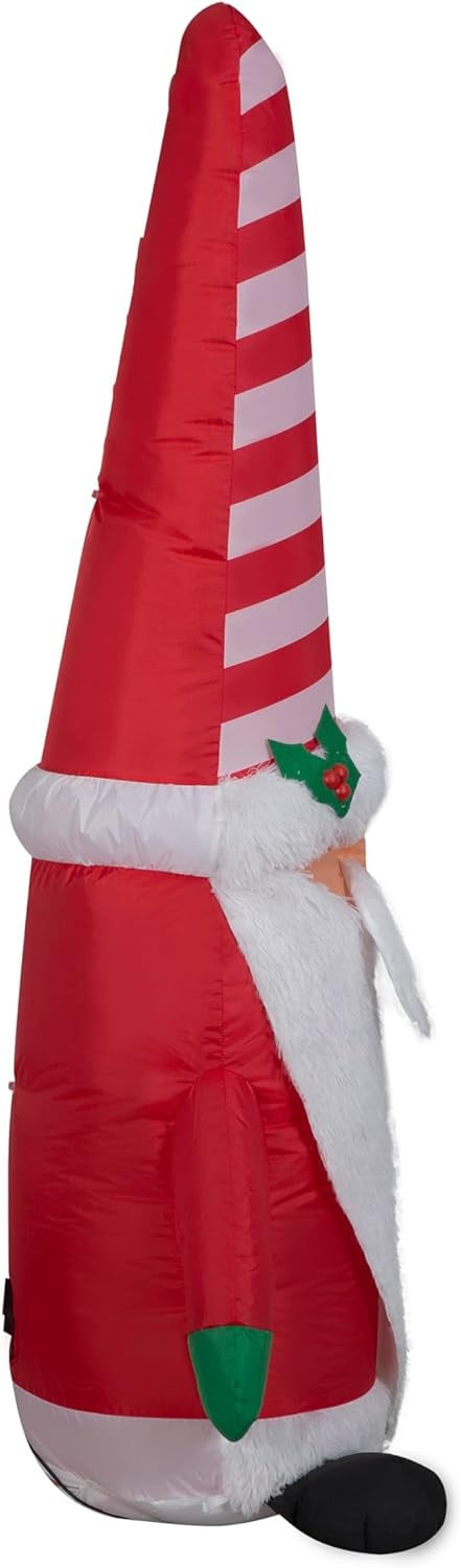 Christmas inflatable shaped like a gnome with a long white beard and a tall, red and white striped Santa hat.