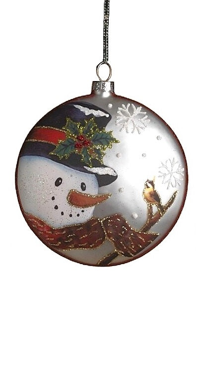 Round ornament featuring a snowman in a winter scene. One ornament has a snowman wearing a red and white scarf and a top hat and is smiling at a squirrel and two cardinals. One ornament has a snowman wearing a red and gold scarf and a top hat and is smiling at a bird on a branch. One ornament has a snowman wearing a red, green and gold scarf and a Santa hat. Each ornament features holly leaves and berries and snowflakes.
