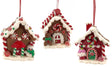 Ornaments shaped like gingerbread houses decorated with sugar, frosting, peppermint candies, gummy candies and candy canes.