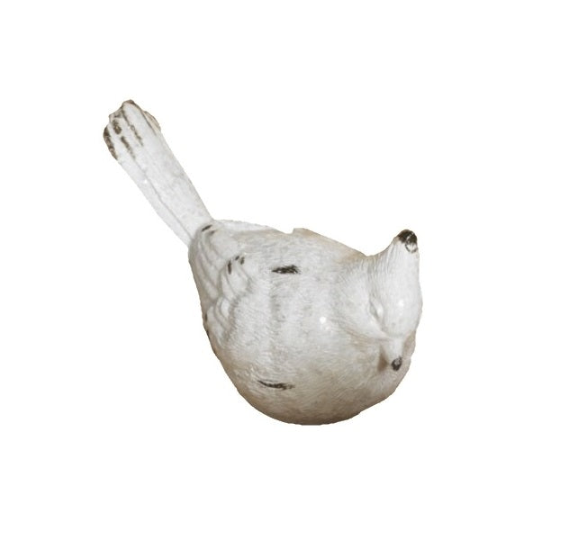 White resin bird figurine.