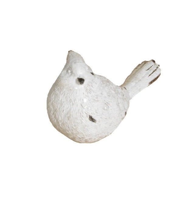White resin bird figurine.