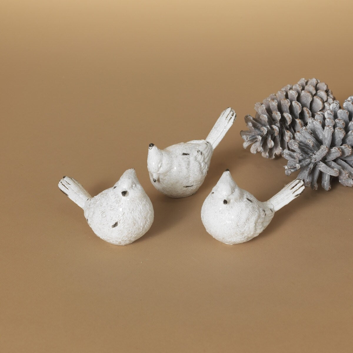 White resin bird figurine.