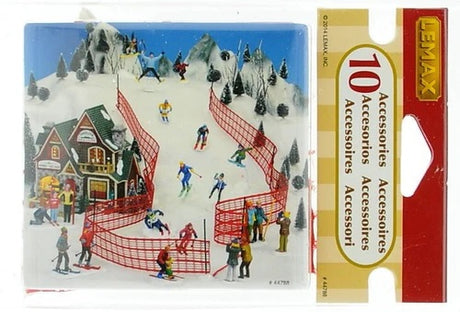Plastic village accessories for a Lemax display. Set of 8 poles with snow at the bottom and two long red nets. You set the poles up in your village however you like and drape the nets around them to create a ski course.
