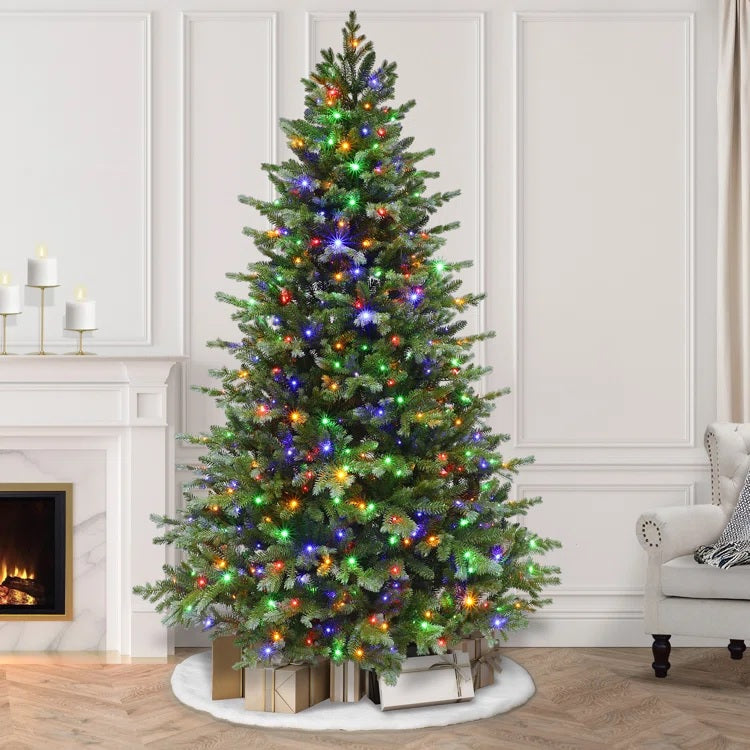 Artificial pine tree pre-lit with color-changing LED lights. In this image, the lights are multi-colored.