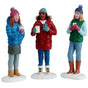 Resin figurines for a Lemax Village tabletop display. Designed to look like three women chatting in the snow. They're all wearing winter clothes and holding a cup.
