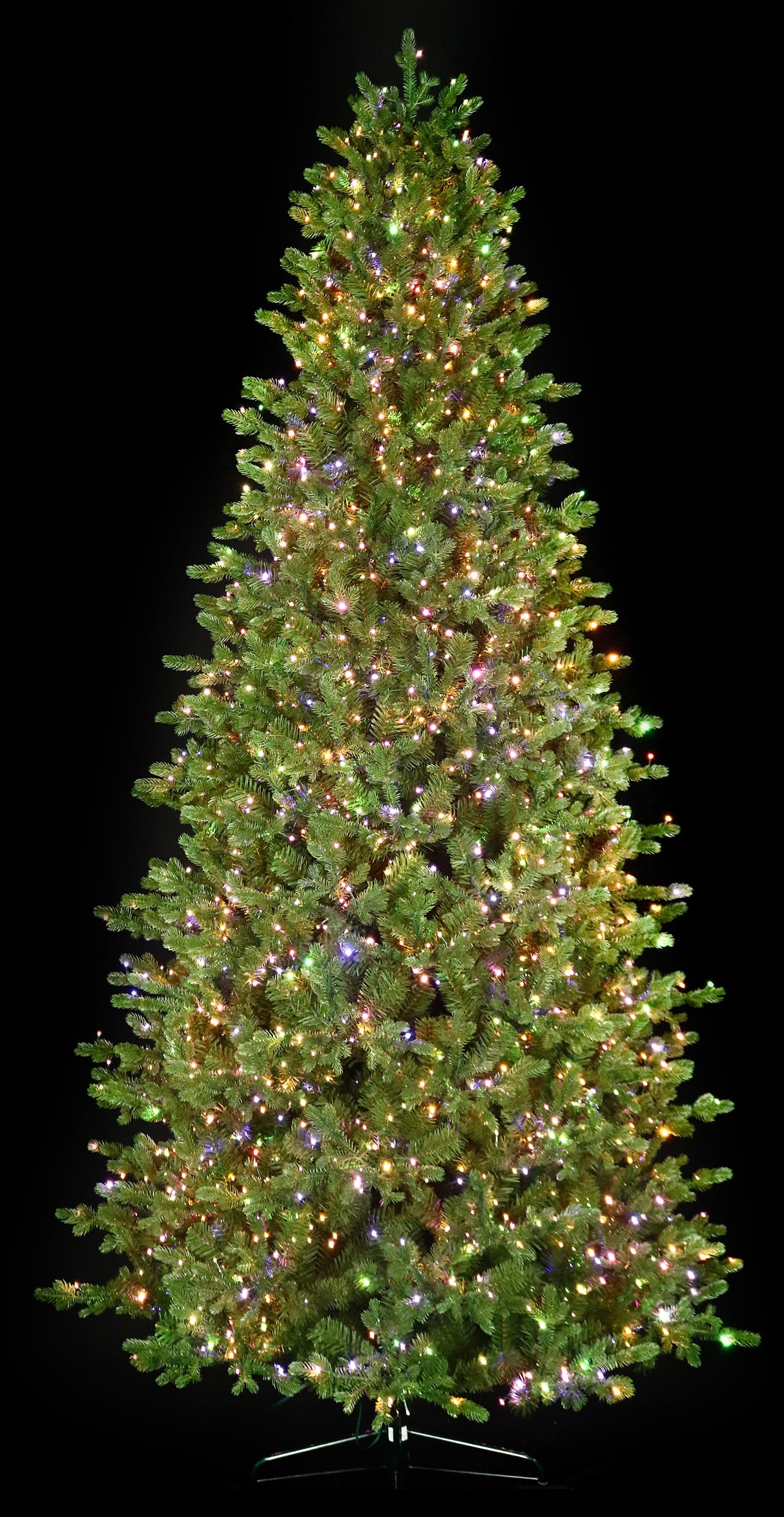 Artificial Christmas tree with color-changing, starry LED lights.