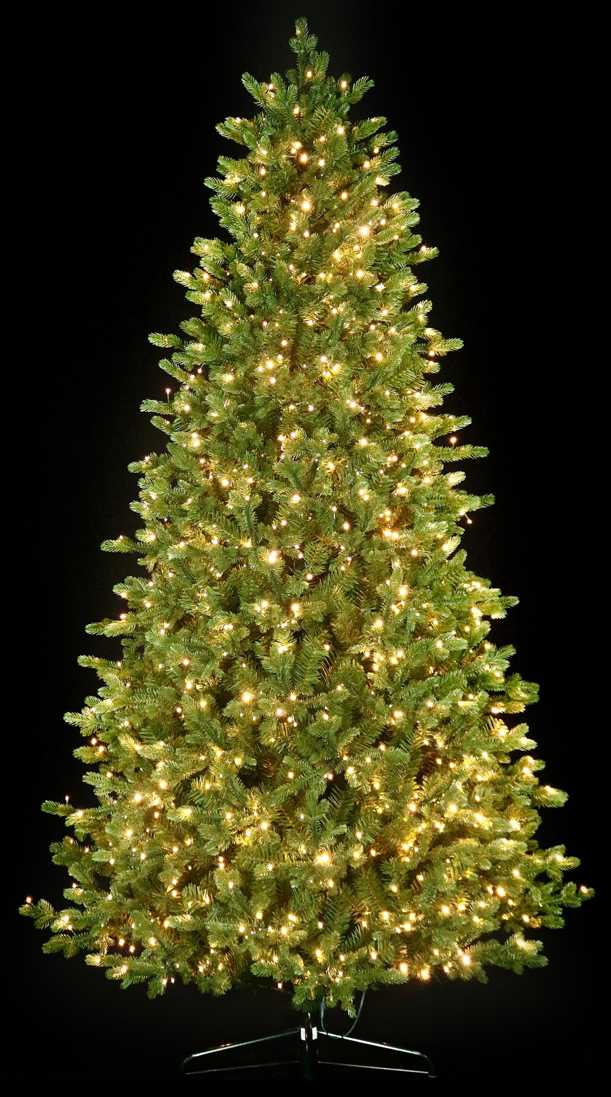 Artificial Christmas tree with color-changing, starry LED lights.