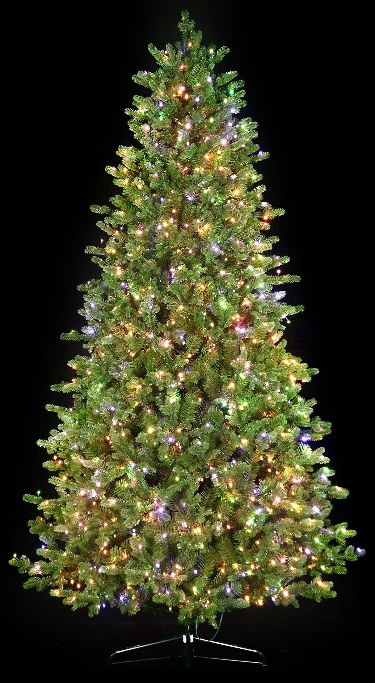 Artificial Christmas tree with color-changing, starry LED lights.