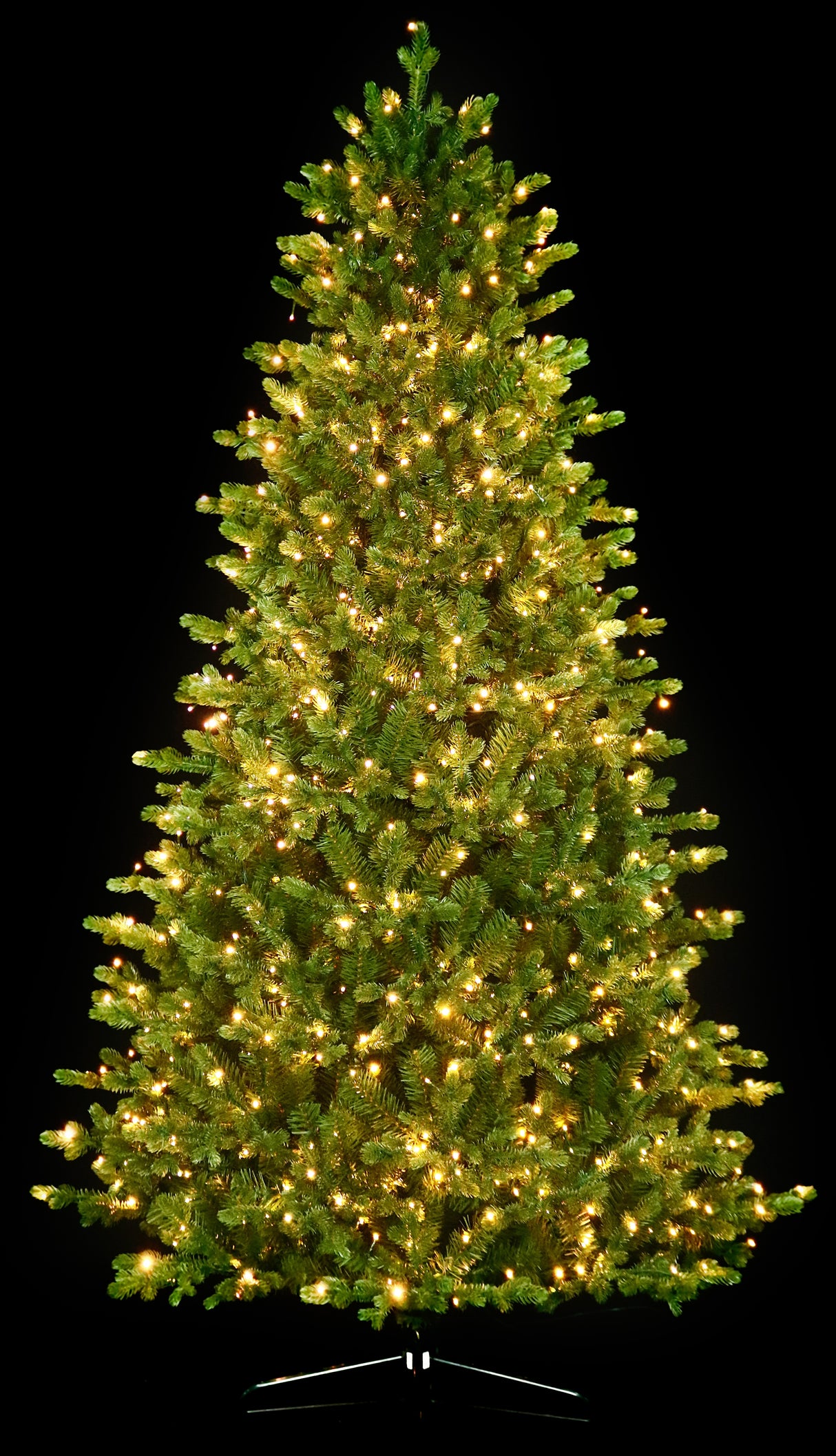 Artificial Christmas tree with color-changing, starry LED lights.