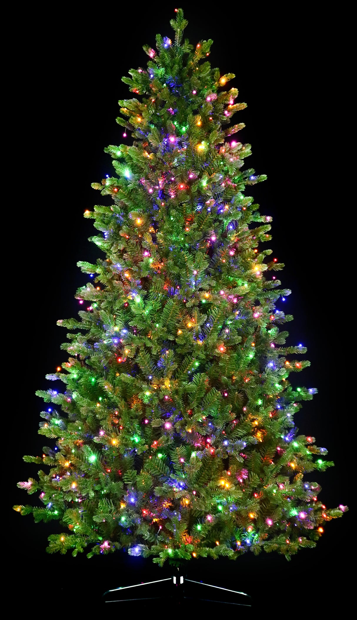 Artificial Christmas tree with color-changing, starry LED lights.