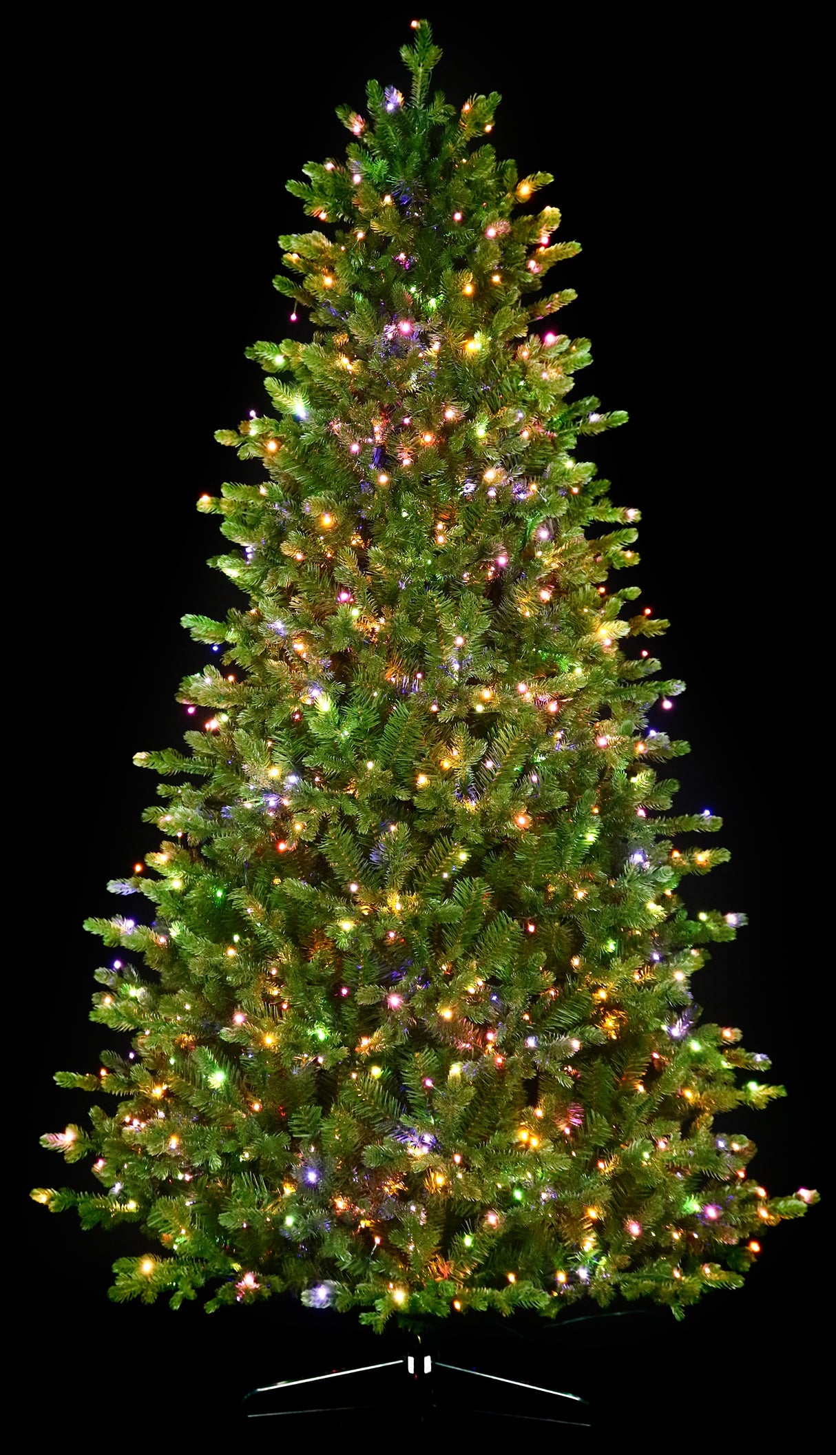Artificial Christmas tree with color-changing, starry LED lights.