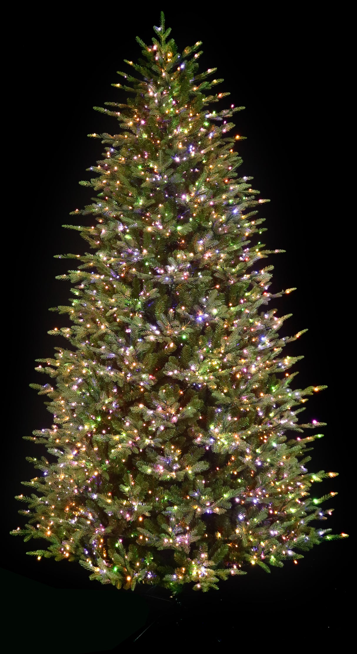 Artificial Christmas tree pre-lit with color-changing LED lights.