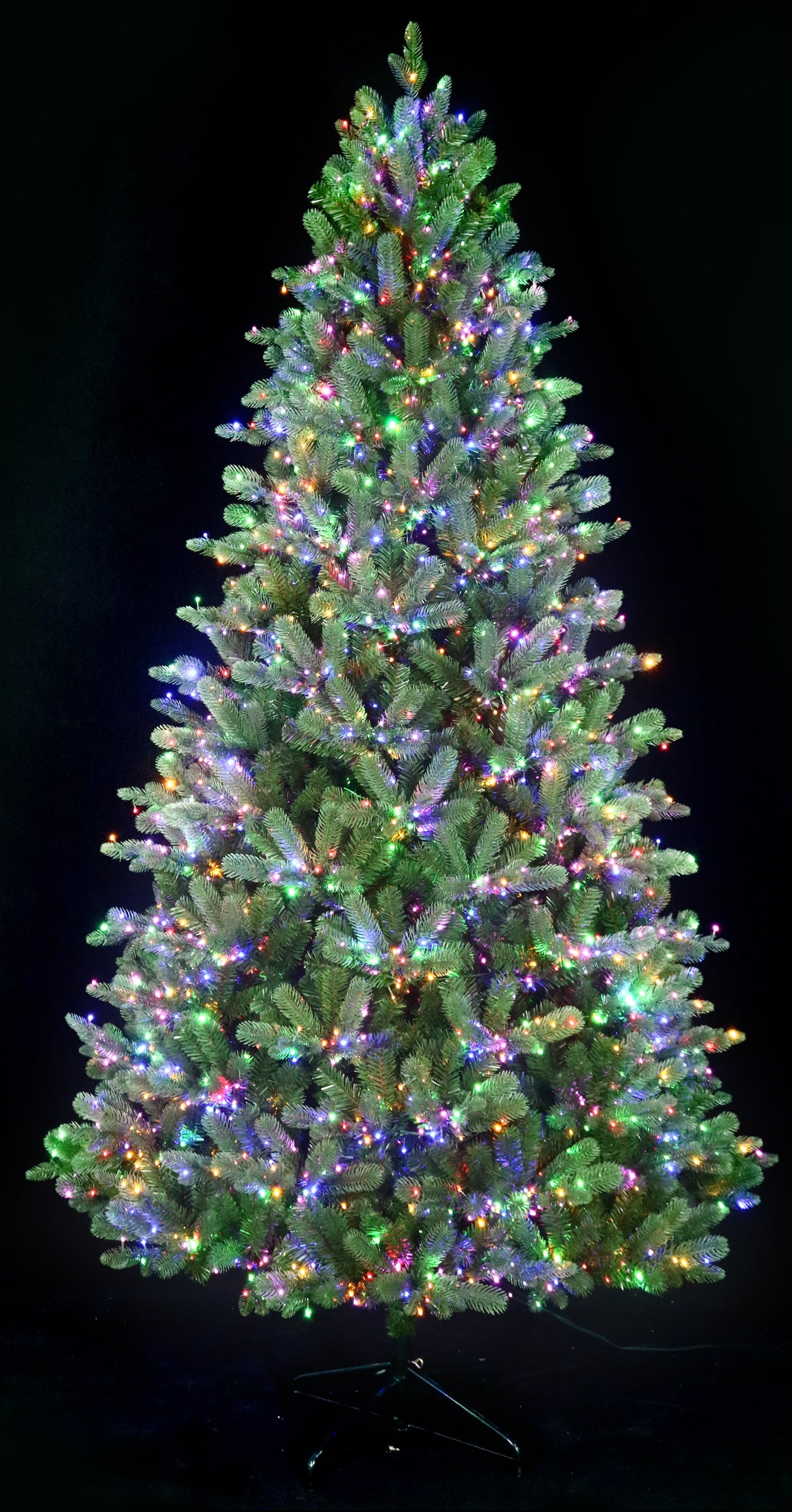Artificial Christmas tree pre-lit with color-changing LED lights.