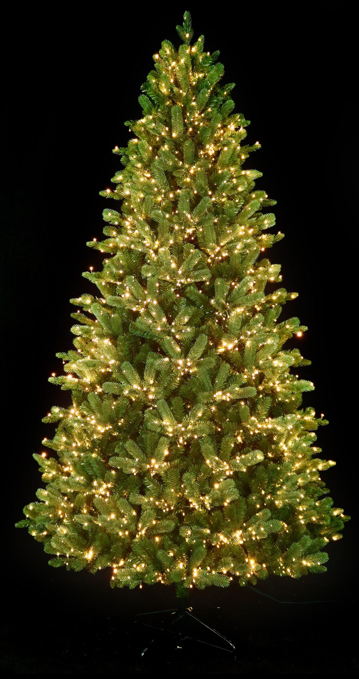 Artificial Christmas tree pre-lit with color-changing LED lights.