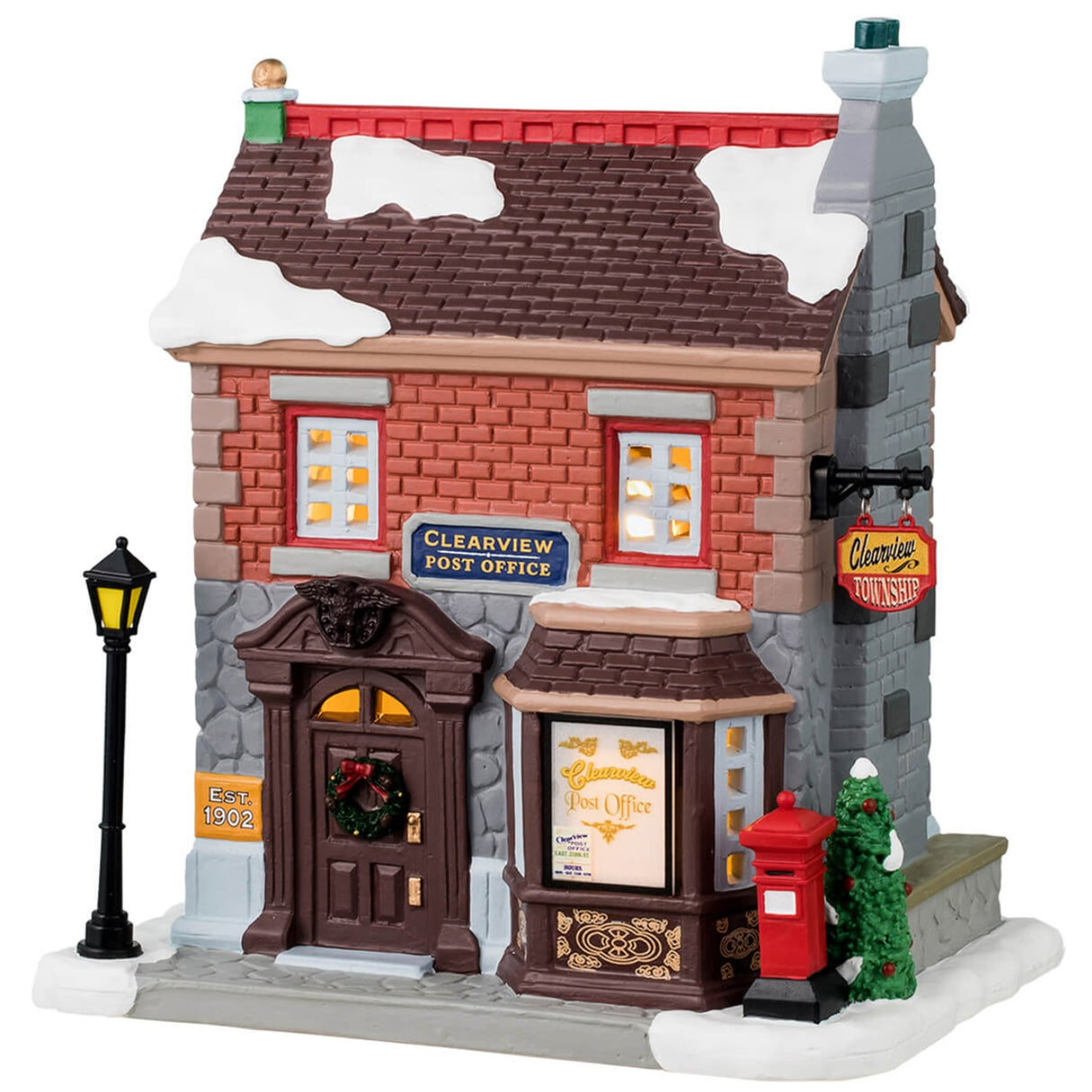 Porcelain lighted building for a Lemax display. Designed to look like a brick and stone building. There's snow on the roof and on the sidewalk. The sign above the door reads "Clearview Post Office."