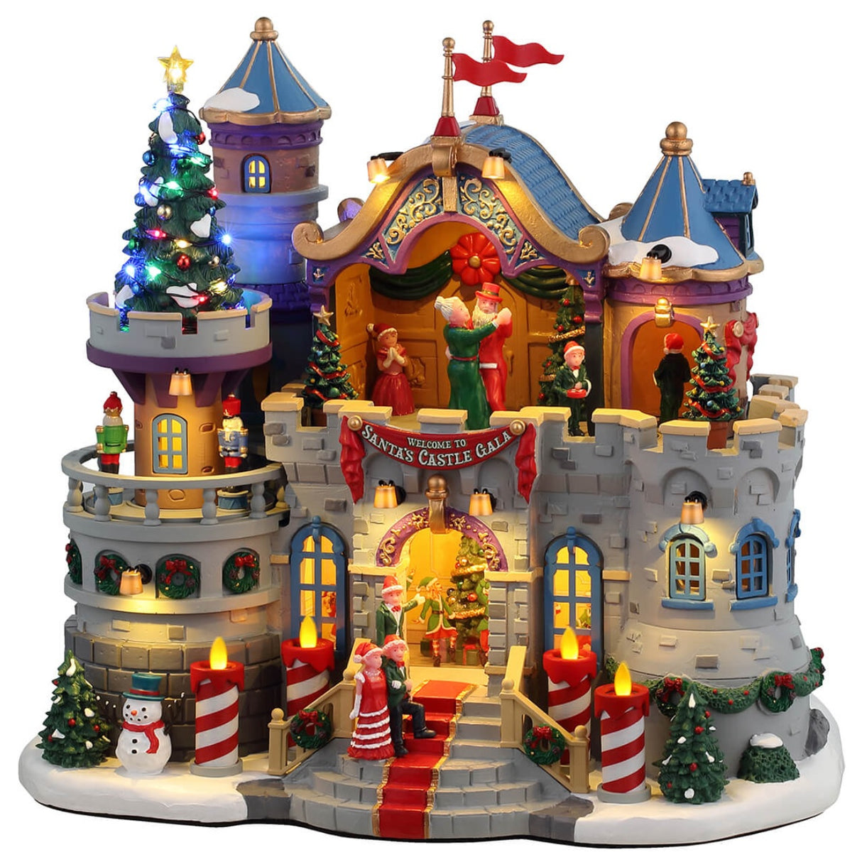 Resin lighted building for a Lemax display. Designed to look like a stone castle decorated for a Christmas gala with Santa. There are people dancing on the balcony and decorative nutcrackers. There are decorated Christmas trees, a snowman and red/white striped candle lights outside.
