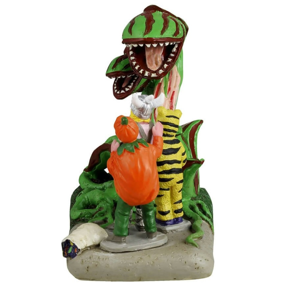 Resin figurine for a Lemax display. Designed to look like three trick or treaters getting scared by Venus fly traps that have come to life. One is dressed as a tiger, one is dressed as a Viking and the other is dressed as a pumpkin.