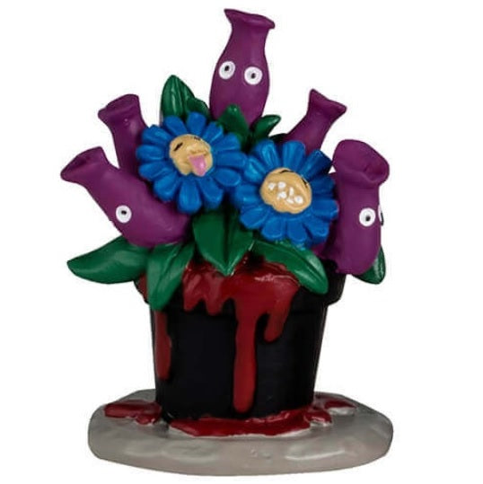 Resin table accents for a Lemax display. Designed to look like five really weird, alive plants. One looks like a bunch of green snakes coming out of a pumpkin. One is purple flowers with eyes and blue flowers in a black pot with blood coming out of it. One is red flowers with eyes and the pot reads "Do Not Touch." One is a Venus fly trap and the pot reads "Beware." The other is a purple Venus fly trap and the pot reads "Keep Back 10 feet."