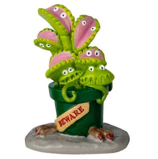 Resin table accents for a Lemax display. Designed to look like five really weird, alive plants. One looks like a bunch of green snakes coming out of a pumpkin. One is purple flowers with eyes and blue flowers in a black pot with blood coming out of it. One is red flowers with eyes and the pot reads "Do Not Touch." One is a Venus fly trap and the pot reads "Beware." The other is a purple Venus fly trap and the pot reads "Keep Back 10 feet."