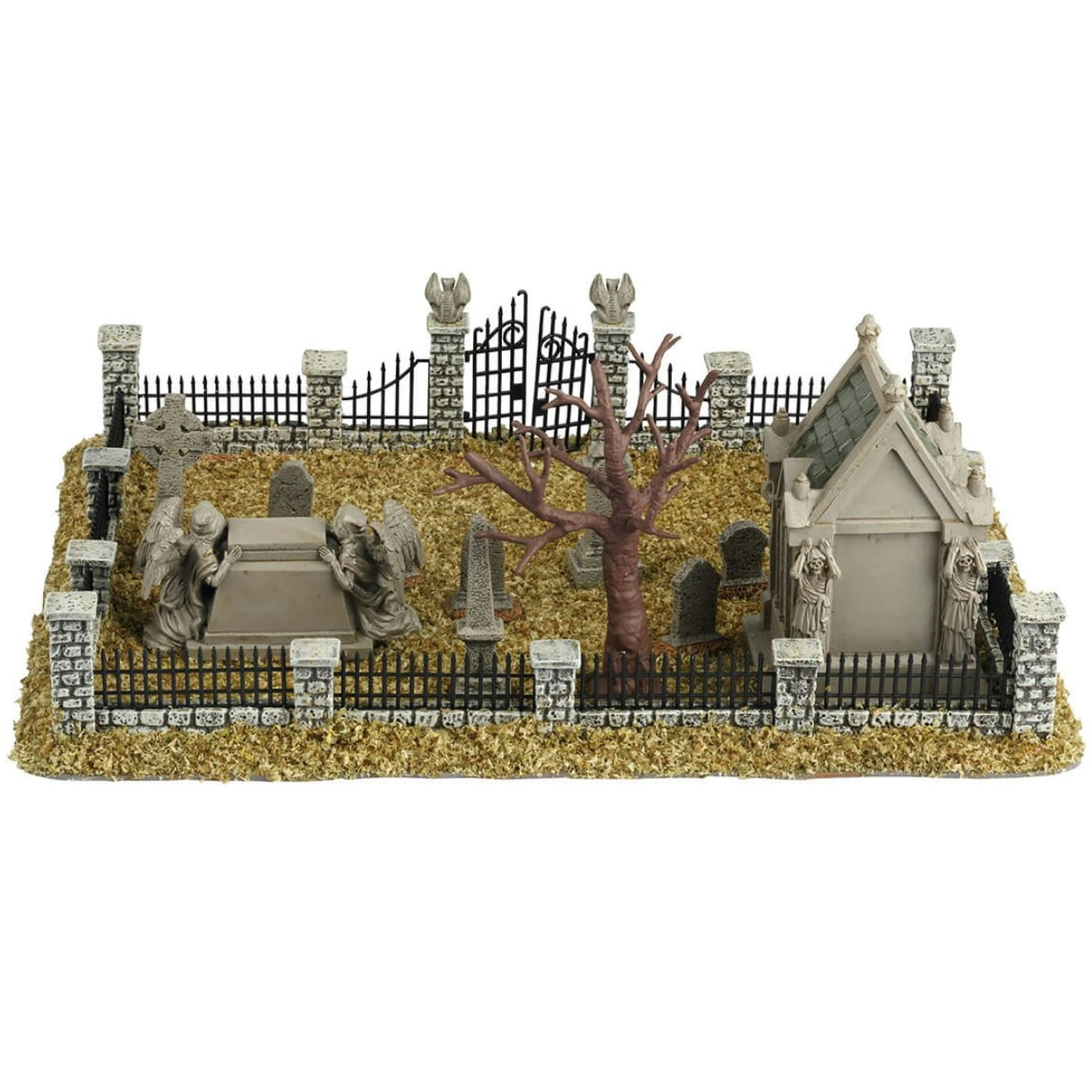 Resin village accent for a Lemax display. Designed to look like a graveyard full of dead grass. There are tombstones and headstones and mausoleums. There's also a bare tree and a metal fence with stone columns.