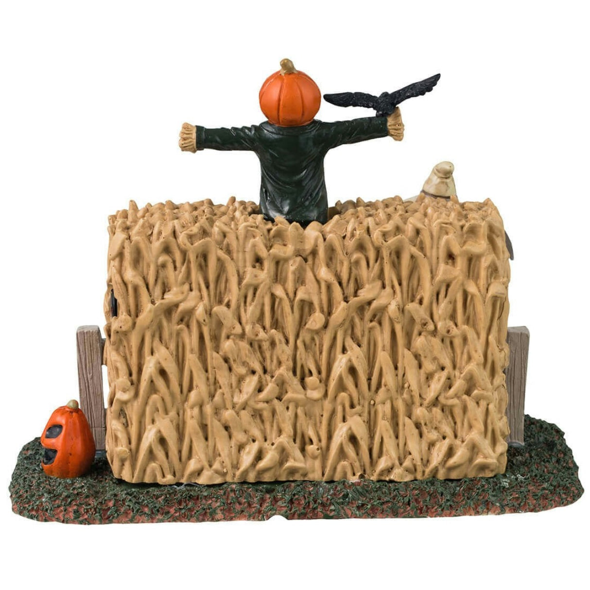 Plastic village accent for a Lemax Spooky Town display. Designed to look like three scarecrows with jack-o-lantern heads coming out of a cornfield. There are glowing red eyes and pumpkins.