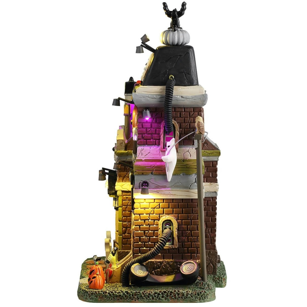 Resin lighted building for a Lemax display. Designed to look like a spooky mansion turned into a telephone company. There are tombstones and jack-o-lanterns in front and ghosts near the roof. It's a little rundown and there are purple lighted accents.