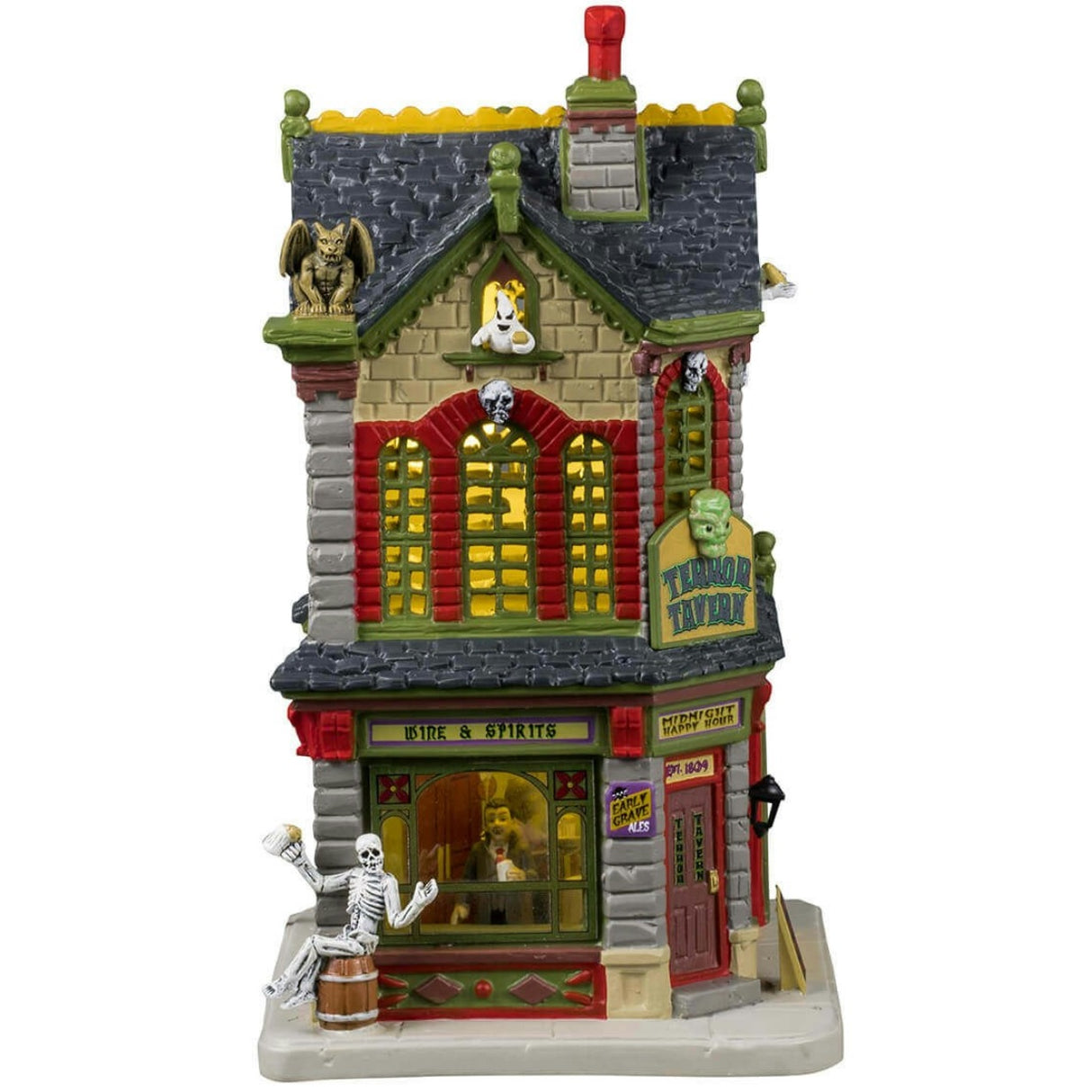Porcelain lighted building for a Lemax display. Designed to look like a yellow-ish tan and gray brick two story tavern. Inside the window, you can see people enjoying a drink. The windows have red shutters. There are gargoyle statues on the roof and skeleton accents everywhere.