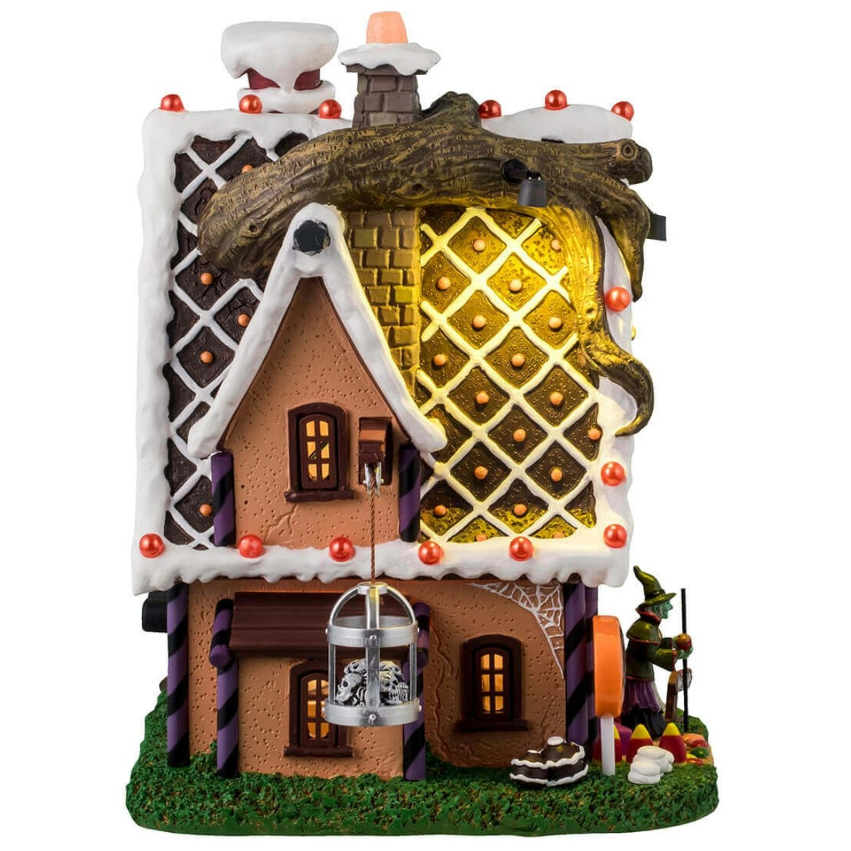 Resin lighted building for a Lemax display. Designed to look like a cabin made out of candy and frosting. There's a spooky tree growing on the side of the cabin and is also growing through the roof. There's a witch standing at the front door.