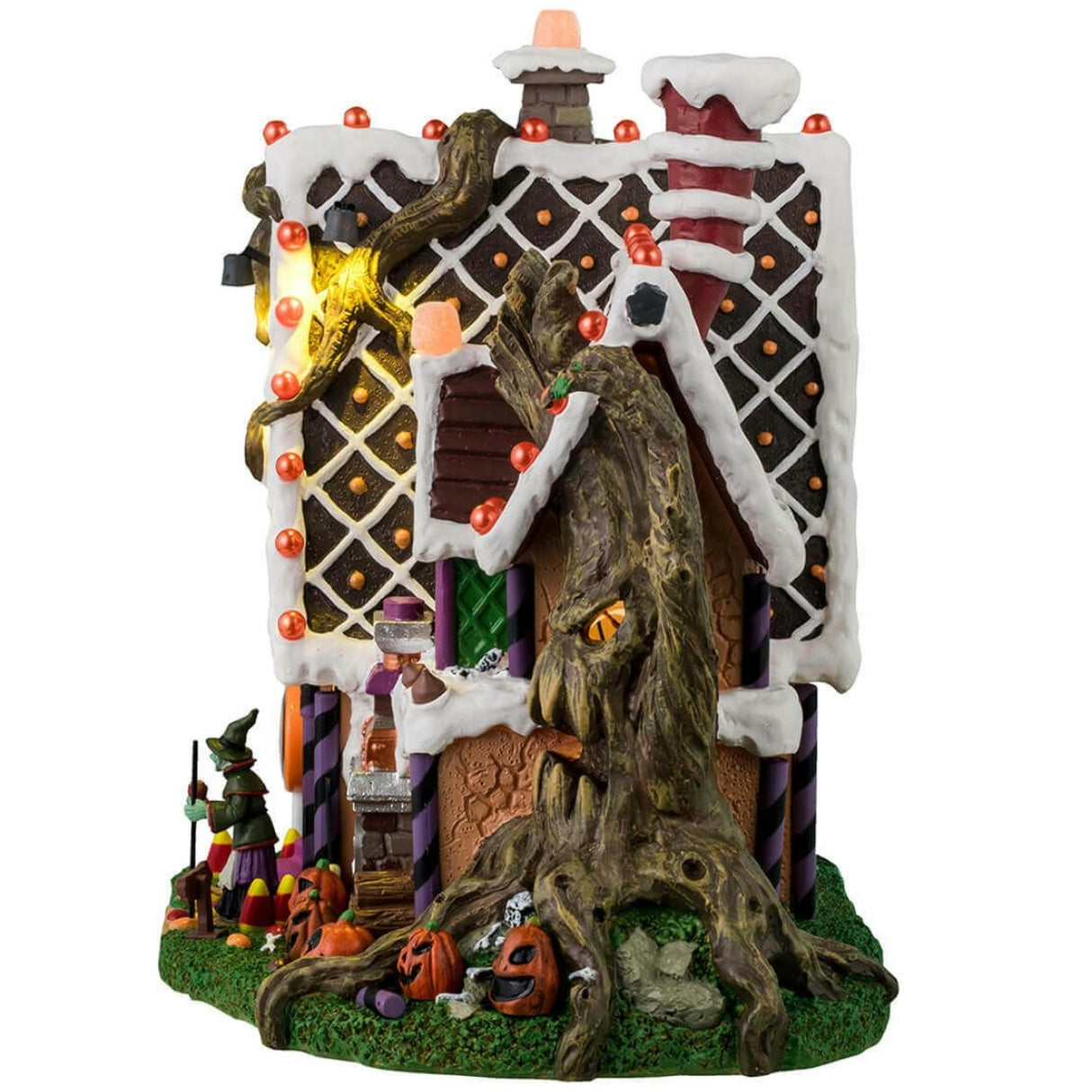 Resin lighted building for a Lemax display. Designed to look like a cabin made out of candy and frosting. There's a spooky tree growing on the side of the cabin and is also growing through the roof. There's a witch standing at the front door.
