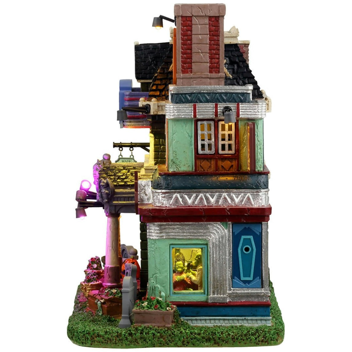 Resin lighted building for a Lemax display. Designed to look like a very colorful mortuary. There are tombstones in the front, and a zombie coming out of one of the graves. There are neon signs and inside the windows you can see zombie barbers.