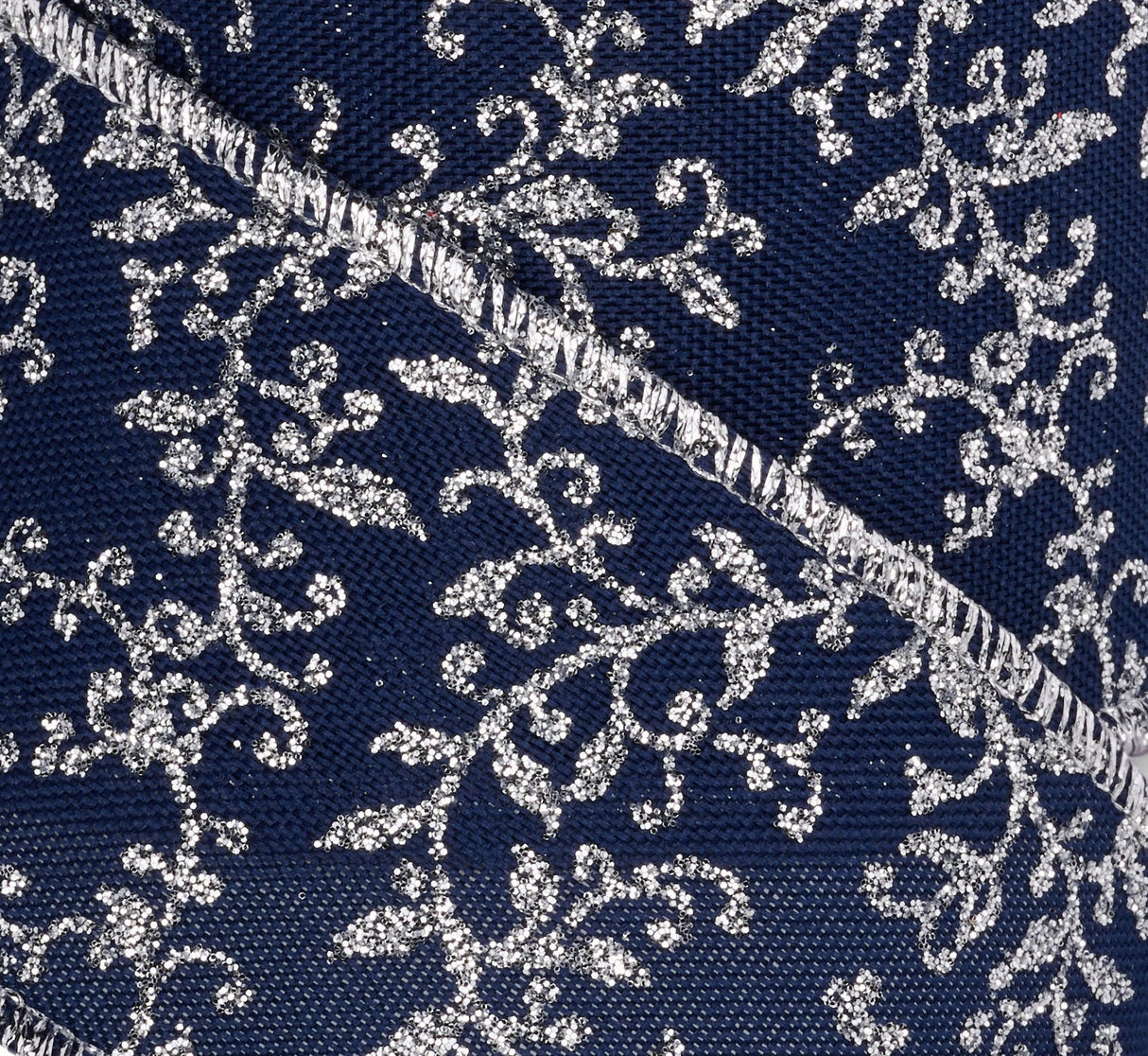 Navy Blue ribbon with a silver mini leaf vine design throughout. Features a silver wired edge.
