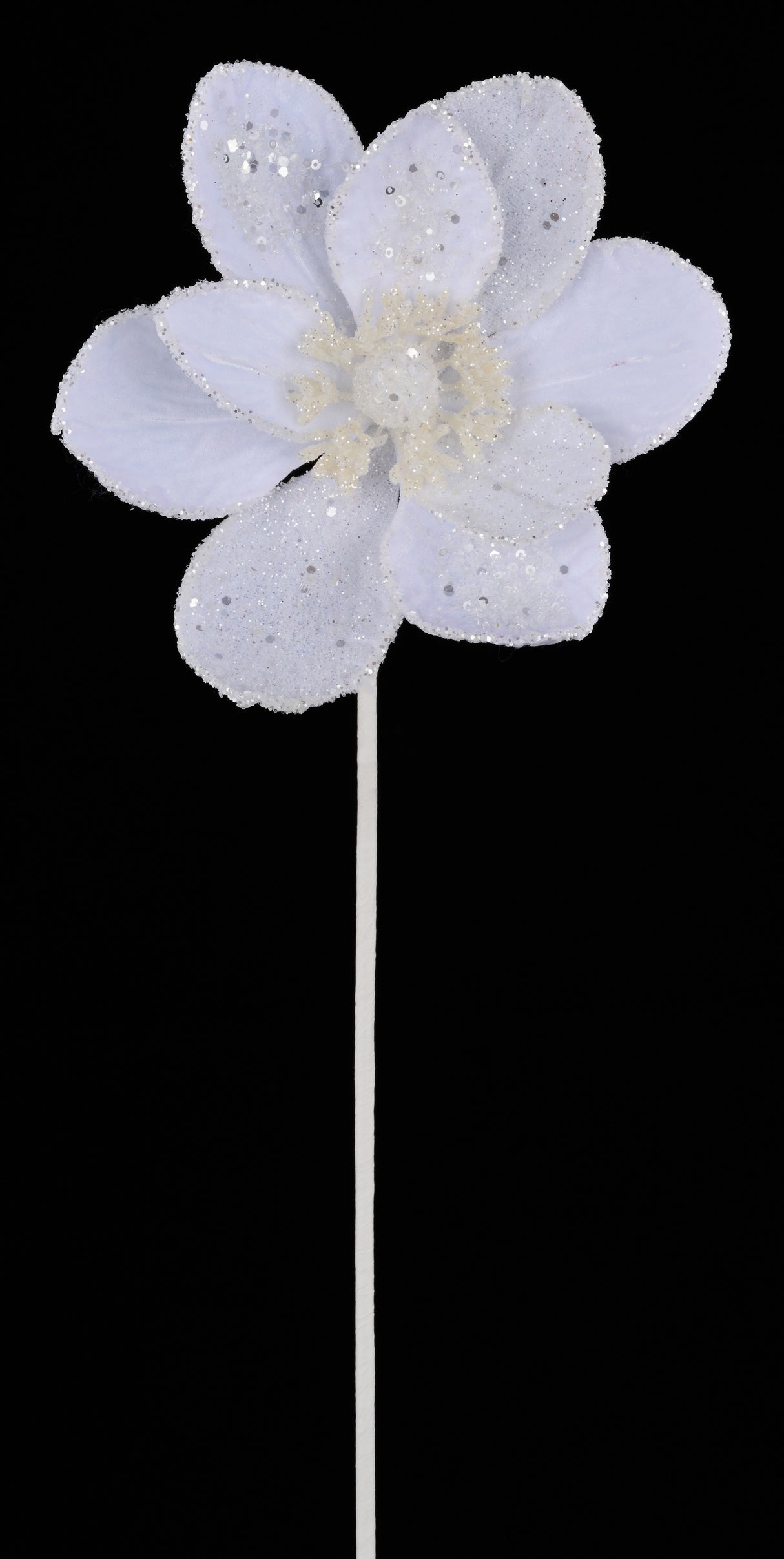 White velvet pick spray designed to look like a magnolia flower covered in glitter.