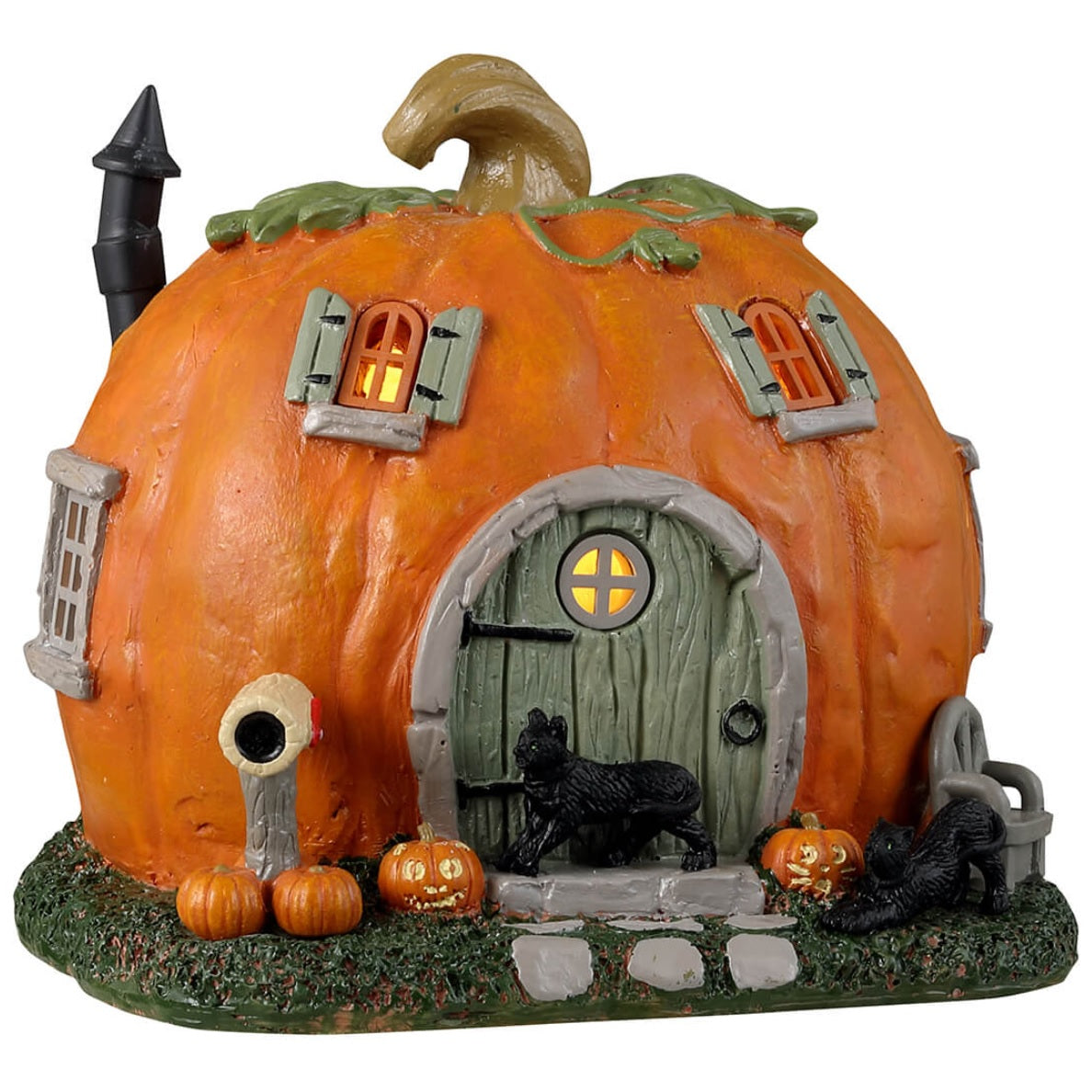 Resin village accent for a Lemax display. Designed to look like a cabin made out of a pumpkin. There are black cats and pumpkin accents. There's also a gray chair outside near the front door.