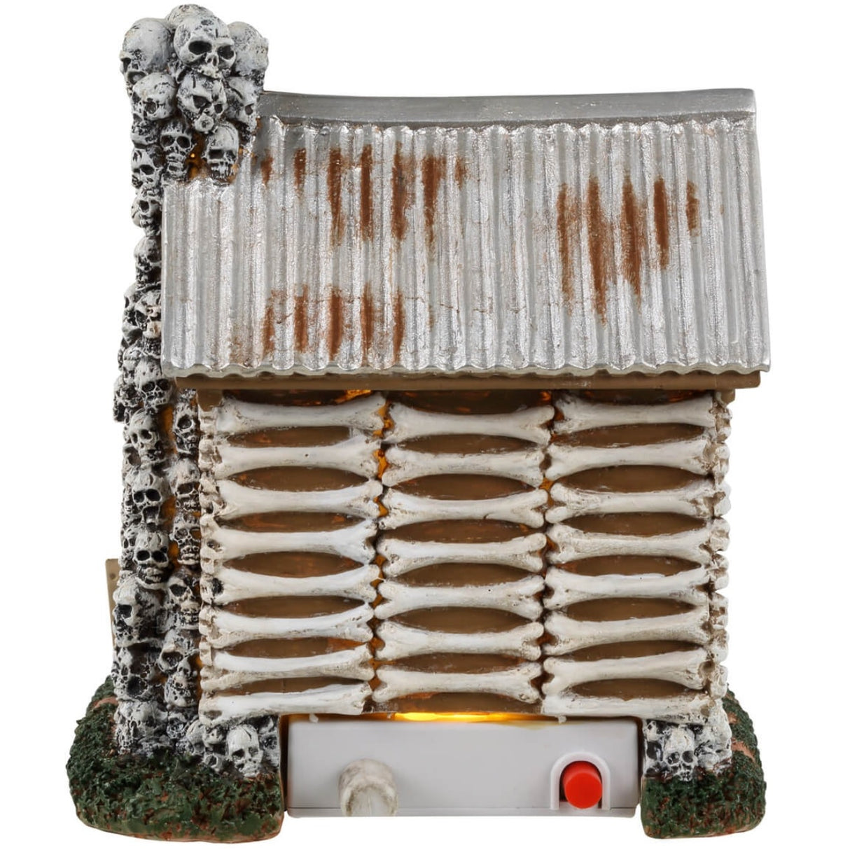 Resin village accent for a Lemax display. Designed to look like an old cabin made out of bones and skulls and wood. There are carved pumpkins on either side of the front door along with a sign that reads "KEEP OUT!"