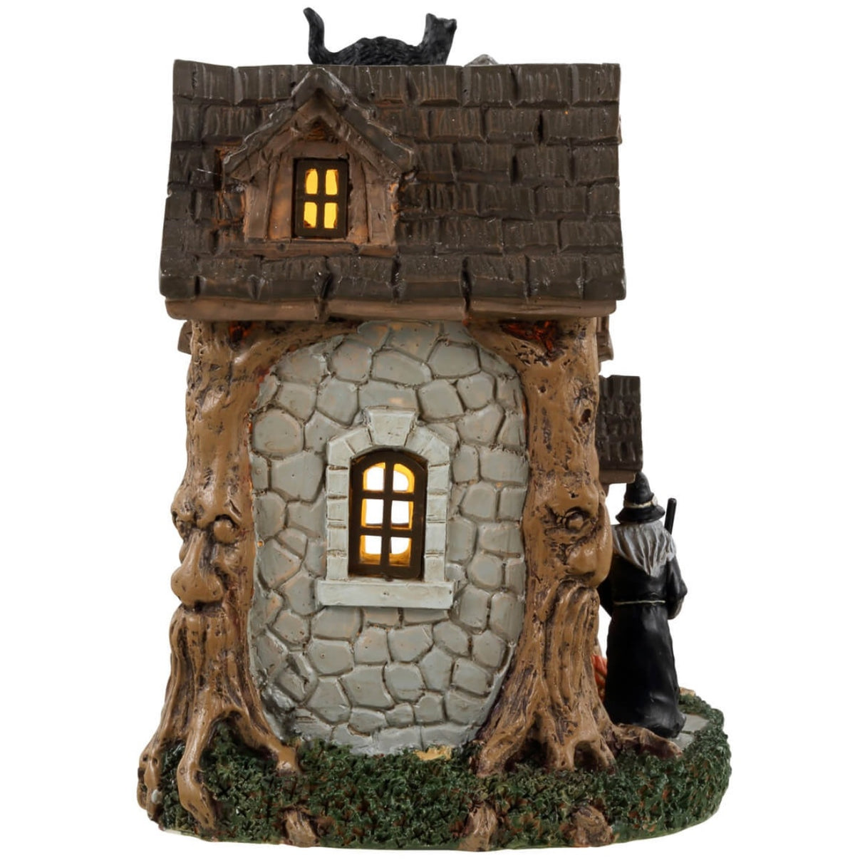 Resin table accent for a Lemax display. Designed to look like an old, stone cottage with vines growing on it. There are also trees growing into the cabin. There's a witch sweeping the front porch and a black cat standing on top of the chimney.