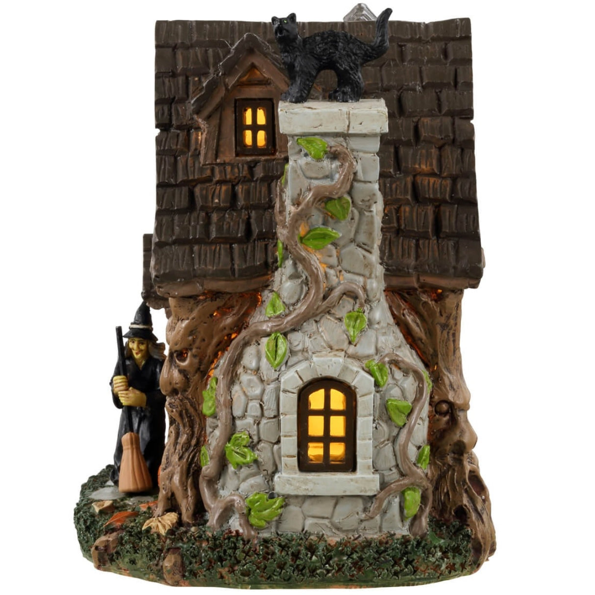 Resin table accent for a Lemax display. Designed to look like an old, stone cottage with vines growing on it. There are also trees growing into the cabin. There's a witch sweeping the front porch and a black cat standing on top of the chimney.