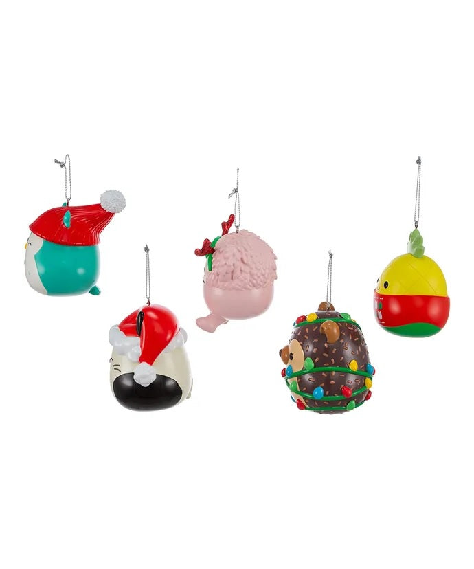 Blow mold Squishmallow ornament. One ornament is Winston the teal owl. One ornament is Cam the calico cat. One ornament is Hans the brown hedgehog. One ornament is Maui the yellow pineapple. One ornament is Brina the pink bigfoot.