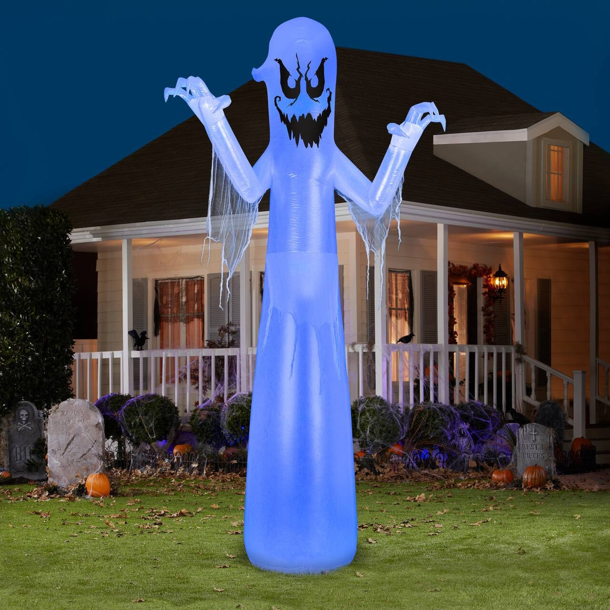 Halloween inflatable shaped like a tall, scary ghost.