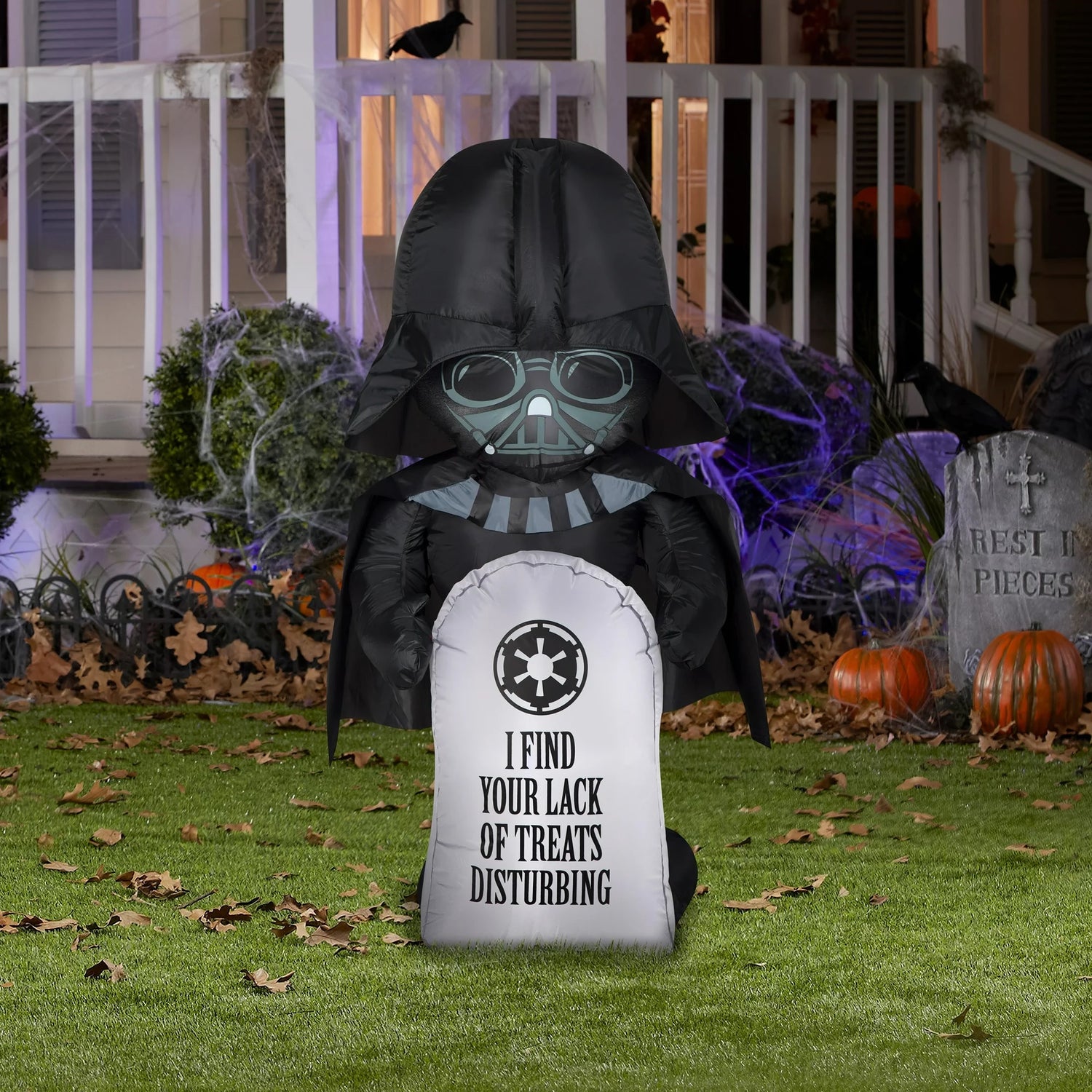 Halloween inflatable shaped like Darth Vader from the Star Wars universe. He's holding a tombstone that reads "I find your lack of treats disturbing." It also features the Galactic Republic's crest logo.