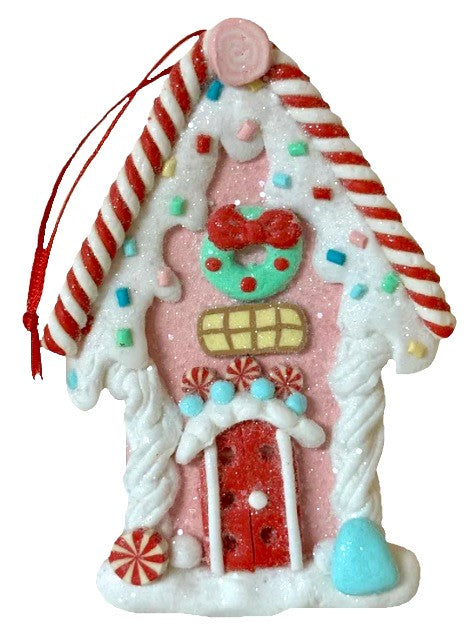 One gingerbread house is teal with a holly leaf accent. One gingerbread house is pink with a wreath accent. One gingerbread house is brown with a peppermint accent. Each ornament features faux candy canes, frosting and gum drop accents.