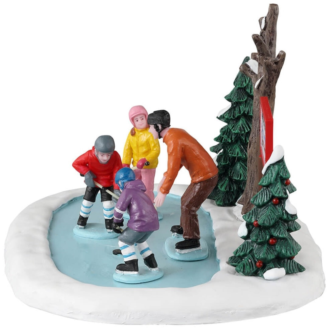 Resin village accent for a Lemax display. Designed to look like a teacher helping three kids learn how to play hockey.