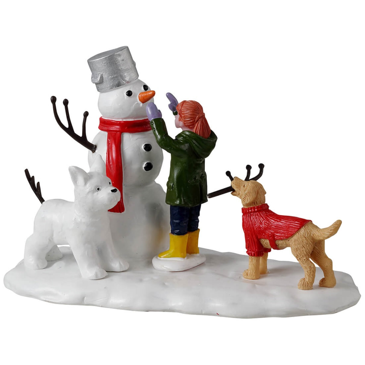 Resin village accent for a Lemax display. Designed to look like a young girl putting the finishing touches on a snowman. There's a dog holding a twig, trying to help. There's a dog made out of snow standing next to the snowman.