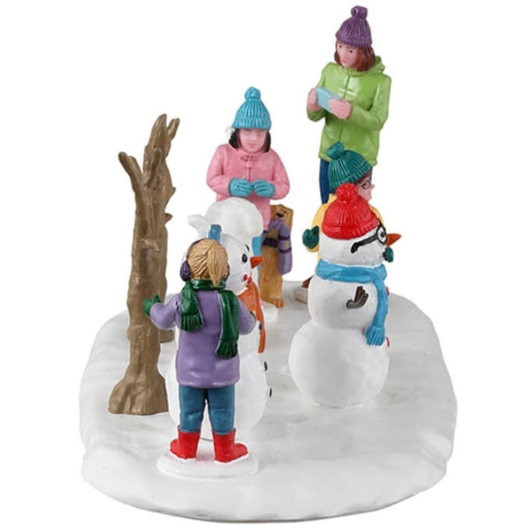 Resin village accent for a Lemax display. Designed to look like a group of people putting clothes on snowmen.