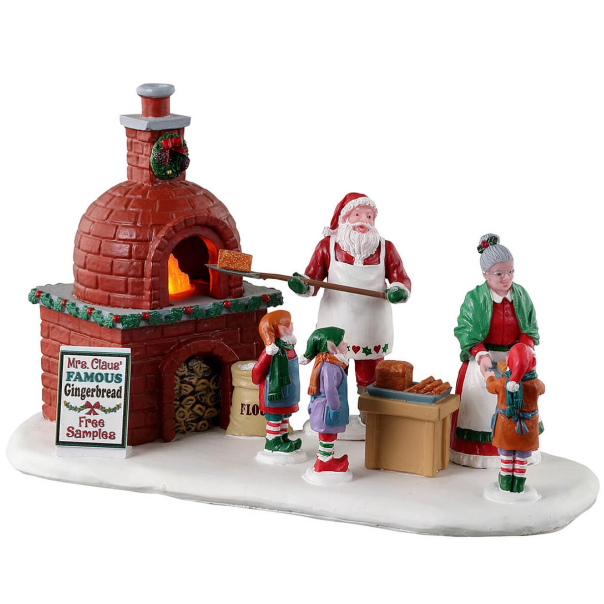 Resin village accent for a Lemax display. Designed to look like Santa and Mrs. Claus cooking gingerbread in a wood-fired oven. There are three elves helping.