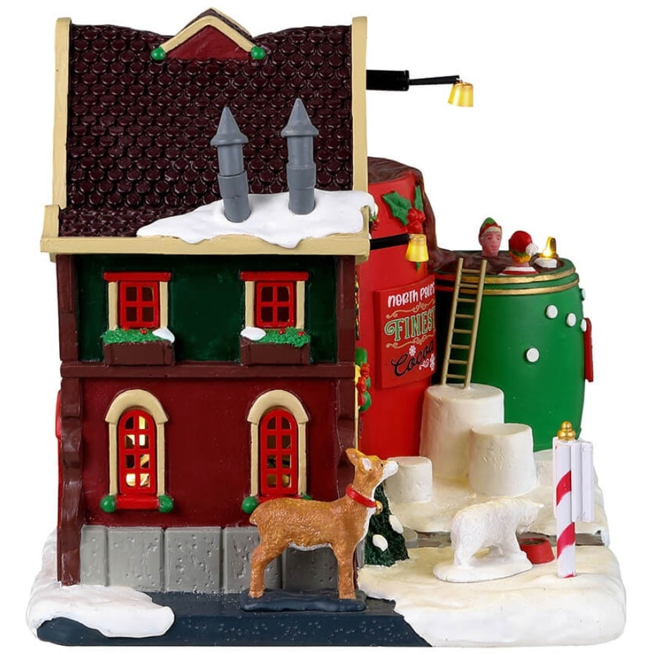 Resin lighted building for a Lemax display. Designed to look like a spa made out of mugs and hot chocolate. The snow is made out of marshmallows.